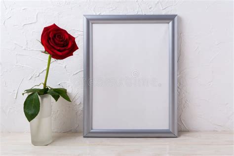 Download Silver frame mockup with red rose in glass vase